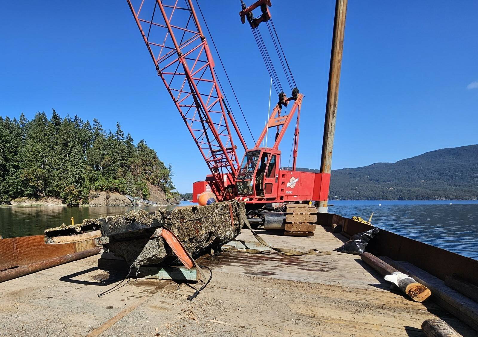 Local contractor A1 Marine e removes a derelict concrete structure from Judd Cove Preserve on Orcas Island.