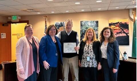 Contributed photo.
Left to right: Councilmembers Christine Minney and Cindy Wolf, Mike Thomas, county clerk Sally Rogers and Councilmember Jane Fuller.
