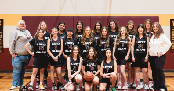 Andrea Huss photo.
Left to right, back row: Assistant Coach Samantha Olson, Saskia Fischer, Evelyn Aguilar-Clavel, Ruby Sausman, Amia Poole, Betty Burt, Kylie Willemsen, Dani Arnott. Middle row: Fatima Velazquez, Ava Bennett, Lulu Velazquez, Iris Ervin-McLean, Lola Woodington, Alivia Trani, Elsie Learing. Coach Karrie Warner. Front row: Seniors Ruby Ervin-McLean, Glory Westervelt, Josie Luckhurst-Slattery.