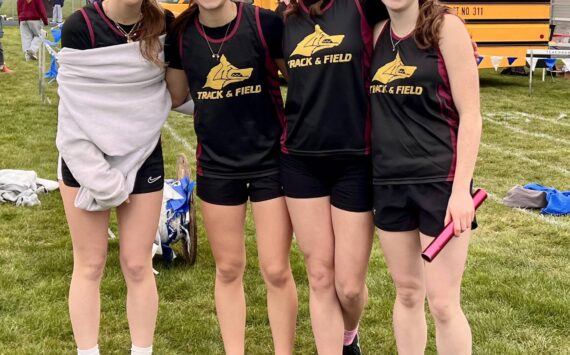 The Lobos girls’ 4x200 meter relay team of (left to right) Iris McClean, Glory Westervelt, Kylie Willemsen and Lily Nichols celebrate their one-second win over Providence Christian in their heat at La Conner, March 19. The Lobos were third overall in a seven-team field, with a personal record time of 1:59.18.