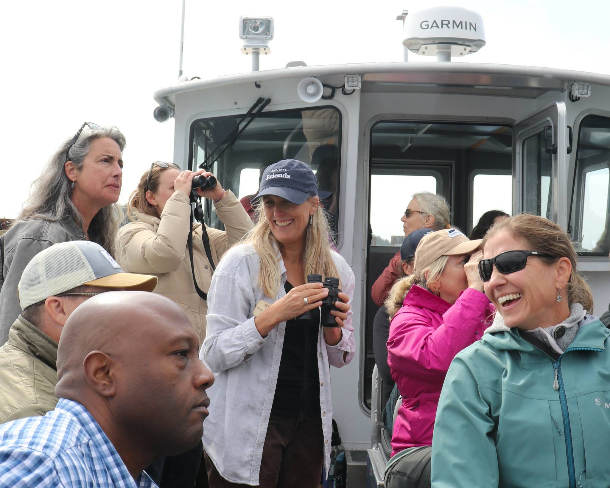 Contributed photo.
Tina Whitman, Friends of the San Juans senior science director (center), with local leaders and guests during the shoreline restoration boat tour, discussing strategies to protect and restore nearshore habitats.