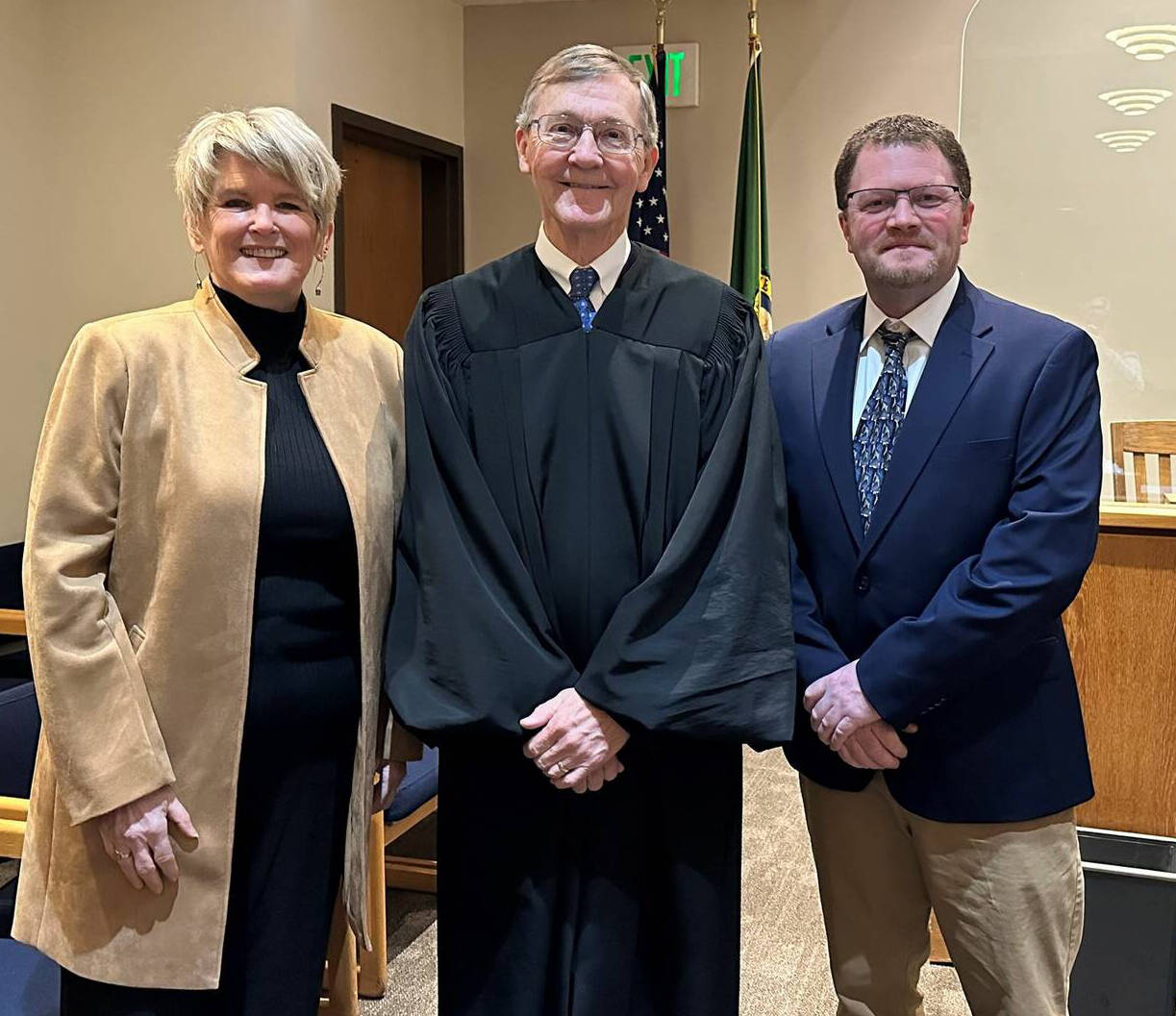 Kari McVeigh, Judge Alan Hancock and Justin Paulsen being sworn in.