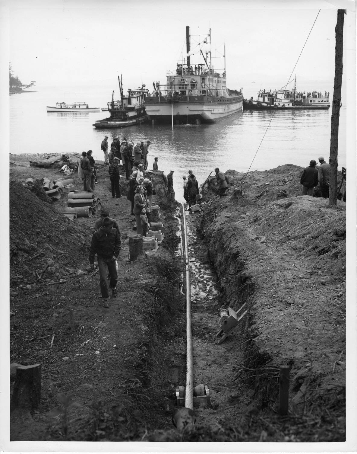 Photo courtesy of Bonneville Power Administration.
In 1951, Bonneville Power Administration engineers completed the installation of a 7.5-mile, 25,000-volt submarine power cable connecting Anacortes to Decatur Island, which was the worlds longest underwater power line at that time.
