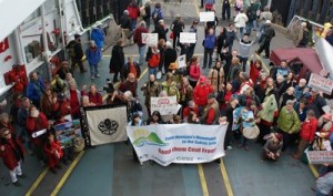 Islanders assemble on ferry car deck before marching up to FHHS to attend the EIS meeting.