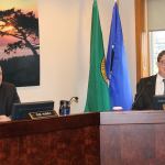 Staff photo/Hayley Day                                Councilmen Rick Hughes and Jamie Stephens listen during the Jan. 24 San Juan County Council meeting.