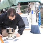 Staff photo/Hayley Day                                Nate Hertel fixes a boat deck at Albert Jensen and Sons Boat Yard and Marina on San Juan Island. Hertel learned boat repair while in the U.S. Coast Guard.