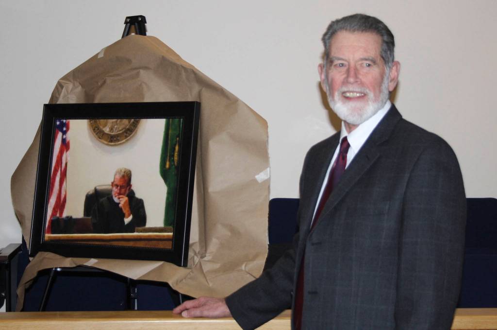 Staff photo/Hayley Day                                San Juan County Superior Court Judge Donald Eaton smiles in front of his portrait.