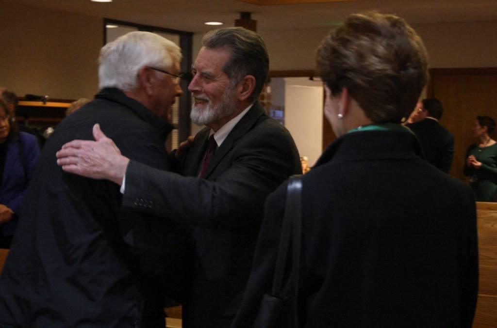 Staff photo/Hayley Day                                Well wishers congratulate San Juan County Superior Court Judge Donald Eaton at his retirement party on Dec. 15.