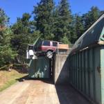 SUV dangles dangerously at the Lopez Dump