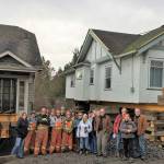 Contributed photo/San Juan Community Home Trust                                The Nickel Brothers crew and onlookers stand in front of the new home trust houses on San Juan.