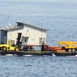 Contributed photo/OPAL                                An OPAL house is barged to Orcas Island.