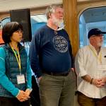 Contributed photo/OPALCO                                Elections and Governance Committee (EGC) members Chom Greacen, Ray Glaze and Rob Thesman listen                                as EGC Chair Bill Severson reads the election results.