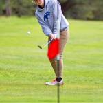 Contributed photo                                Senior golfer Zoe Reinmuth chips onto the fifth green at the Lopez Golf Course in recent match play against Grace Academy.