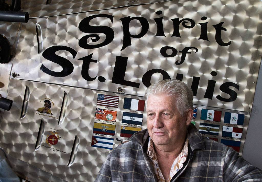 John Norman stands next to the nose of his exact replica of the Spirit of St. Louis before its maiden flight from Arlington Municipal Airport on July 28. (Andy Bronson / The Herald)
