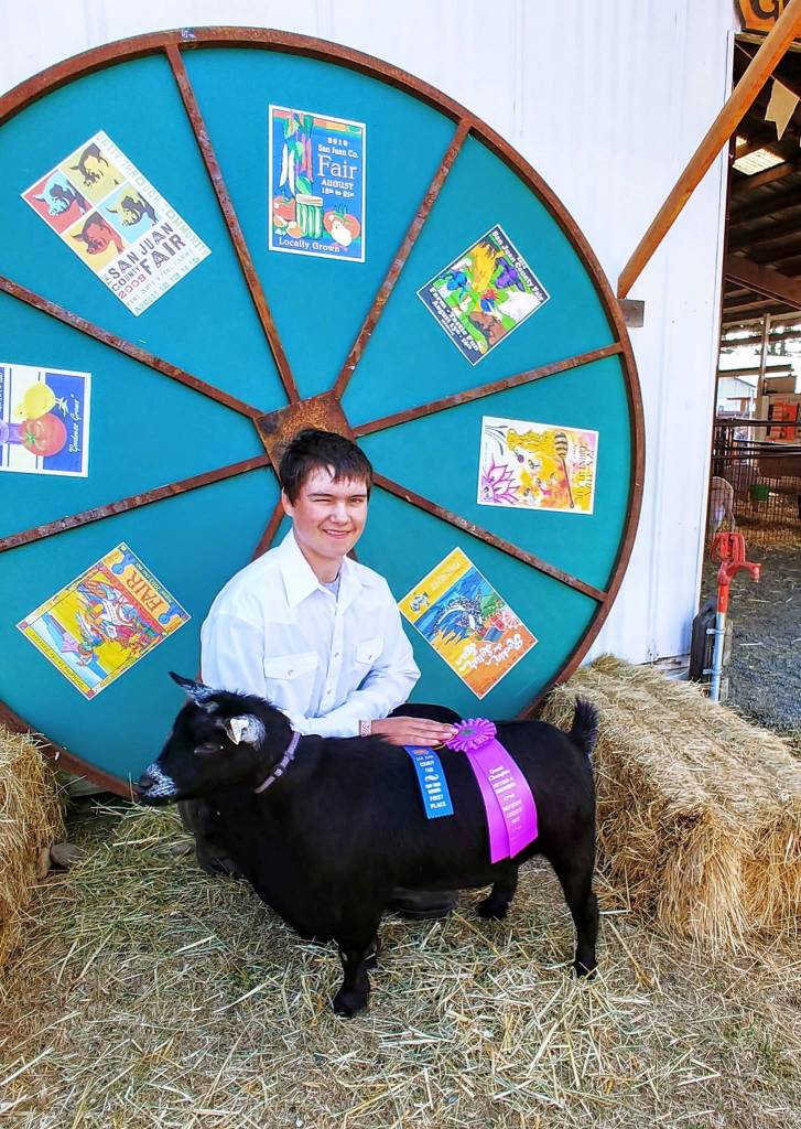 Kyle Willis/Contributed photo                                Aiden Willis with his 4H Grand Champion Pygmy goat, Augustus.
