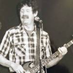 Contributed photos                                Right: Larry at the 4-H livestock auction. Left: Larry playing bass 30 years ago.