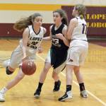 Gene Helfman/Contributed photos                                Top: Avery Conner fights for a rebound against Shoreline Christian as Travis Arnott (42) moves in to assist. Right: Siri Dye drives toward the basket while Shayna Gruenwald (11) blocks a Shoreline defender.