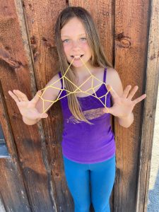 Contributed photo
Cora Limbach of Lopez Island will teach popular string games at the History Museums wool and fiber fest for kids on Saturday. Here she demonstrates the Eiffel Tower pattern.