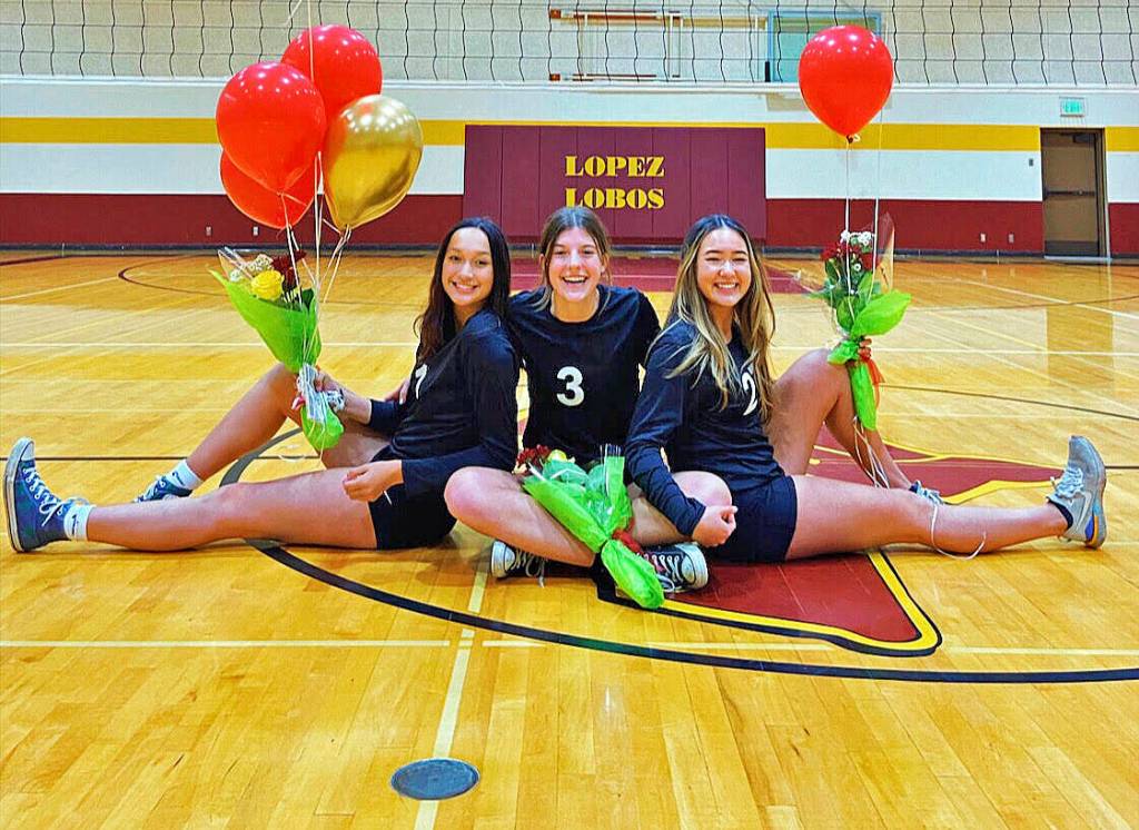 Contributed photo
Volleyball seniors Sophie Allen (left), Camille Steckler (center) and Sara Greacen (right) celebrate at seasons end.