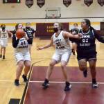 Betty Burt (44) prepares to shoot while Danielle Arnott (33) screens for her and Naima Garcia (20), Michelle Gil (5), and Melissa Valencia (24) move in on a fast break versus Lummi Nation.