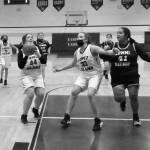 Betty Burt (44) prepares to shoot while Danielle Arnott (33) screens for her and Naima Garcia  (20), Michelle Gil (5), and Melissa Valencia (24) move in on a fast break versus Lummi Nation.