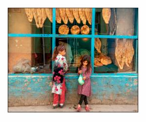 Girls in front of bakery. Photo by James Longley.