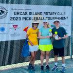 Tournament director Linda Hamilton with Group B Mixed Doubles second-place winners Monica
Connell and Ethan Brazil/Contributed photo