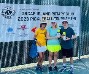 Tournament director Linda Hamilton with Group B Mixed Doubles second-place winners Monica
Connell and Ethan Brazil/Contributed photo