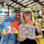 Heather Spaulding \ Staff photo
Two of the SJIMA raffle winners.