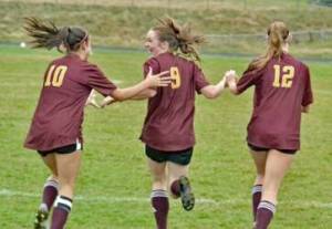Glory Westervelt (10) and Iris Ervin-McLean (12) celebrate Lilly Nichols (9) goal in the first period of the Lobos 2-1 loss to Friday Harbor, Oct. 14.
Contributed photo by Gene Helfman