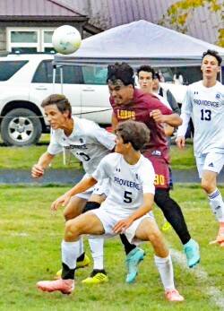 Gene Helfman photo.
Jacob Velazquez-Velazco heads the ball into the Providence goal in the first of his two goals during the Lobos 3-1 win at home, Oct. 14.
