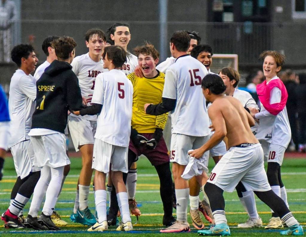 Contributed photo by Kaileah Poole
Jubilant Lopez players celebrate their 1-0 district championship win against Orcas High on Nov. 9th. The win qualified the Lobos for the quarter-finals of the state championship. Stay tuned.