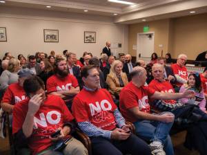 Members of the Rental Housing Association of Washington await the first reading of the rent stabilization bill. Many of them traveled hours to Olympia for the chance to testify Jan. 13. Photo by Juan Jocom.