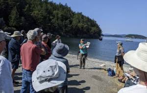 Contributed photo
A coastal scientist guides beach walk participants through an exploration of shoreline ecosystems.
