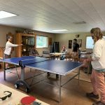 Contributed photo
Participants of Pub Night play a round of Ping-Pong.