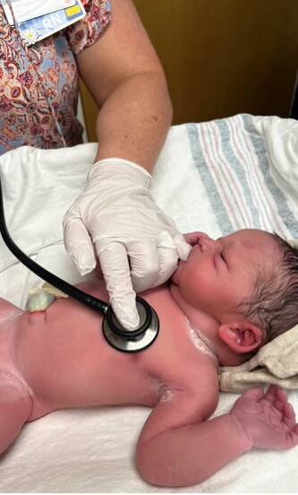 Baby Arlo being checked at the hospital after his ferry birth