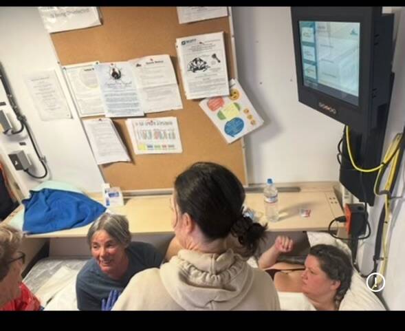 The retired maternity nurse who delivered Arlo is pictured here. If anyone knows her identity, the Macks would appreciate being able to thank her.