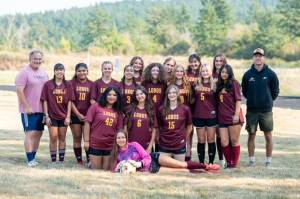 Lolo Meissner photo.
Back row, left to right: Lulu Velazquez, Danna Aquilar-Clavel, Ava Bennett, Fatima Velazquez, Ema Nehtal, Penny Spreine, Iris Ervin-McLean, Ayla Rick, Rosa Charnley, Maggie Rose and Audrey Roush. Bottom row: Evelyn Aguilar-Clavel (C), Kaileah Poole (C), Mae Krantz and Naima Garcia (C). Coaches: Tommer Roush (far left) and Galen Westervelt (right).