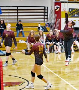 Gene Helfman photo.
Senior Betty Burt spikes the ball in the Lobos straight set win over Lummi Nation at home Sept. 1, while Dani Arnott (5) and Amia Poole (14) look on.