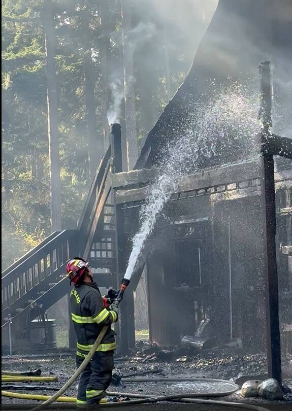 Contributed photo.
Firefighters work to contain the fire.