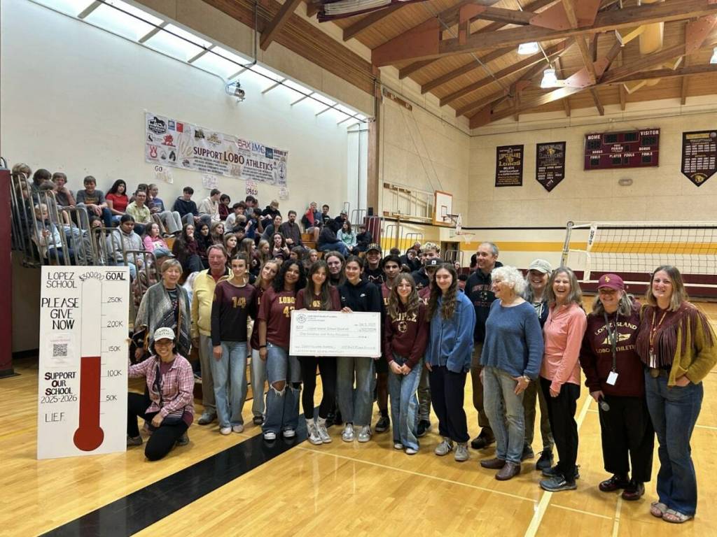 Sara Wysocki photo. Lopez Island School District’s Associated Student Body and Principal Linda Martin received a $140,000 donation from Lopez Island Education Foundation, with its board of trustees and donors, teachers and students in attendance on Sept. 9.