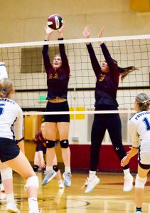 Gene Helfman photo.
Lobos juniors Kylie Willemsen (left) and Ruby Sausman go up to block in the match against Providence Christian at home, Sept. 26. Both Willemsen and Sausman received all-league honors in post-season voting.