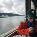 Darrell Kirk photo.
A ferry passenger passes the time.