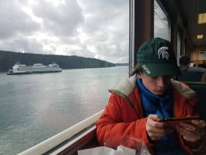 Darrell Kirk photo.
A ferry passenger passes the time.