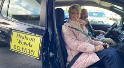 Contributed photo.
Council member Kari McVeigh making a Meals on Wheels delivery.